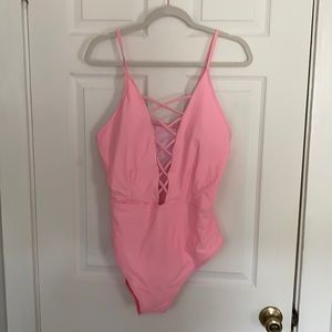 Never worn. Swimsuit, pink, deep V criss-cross